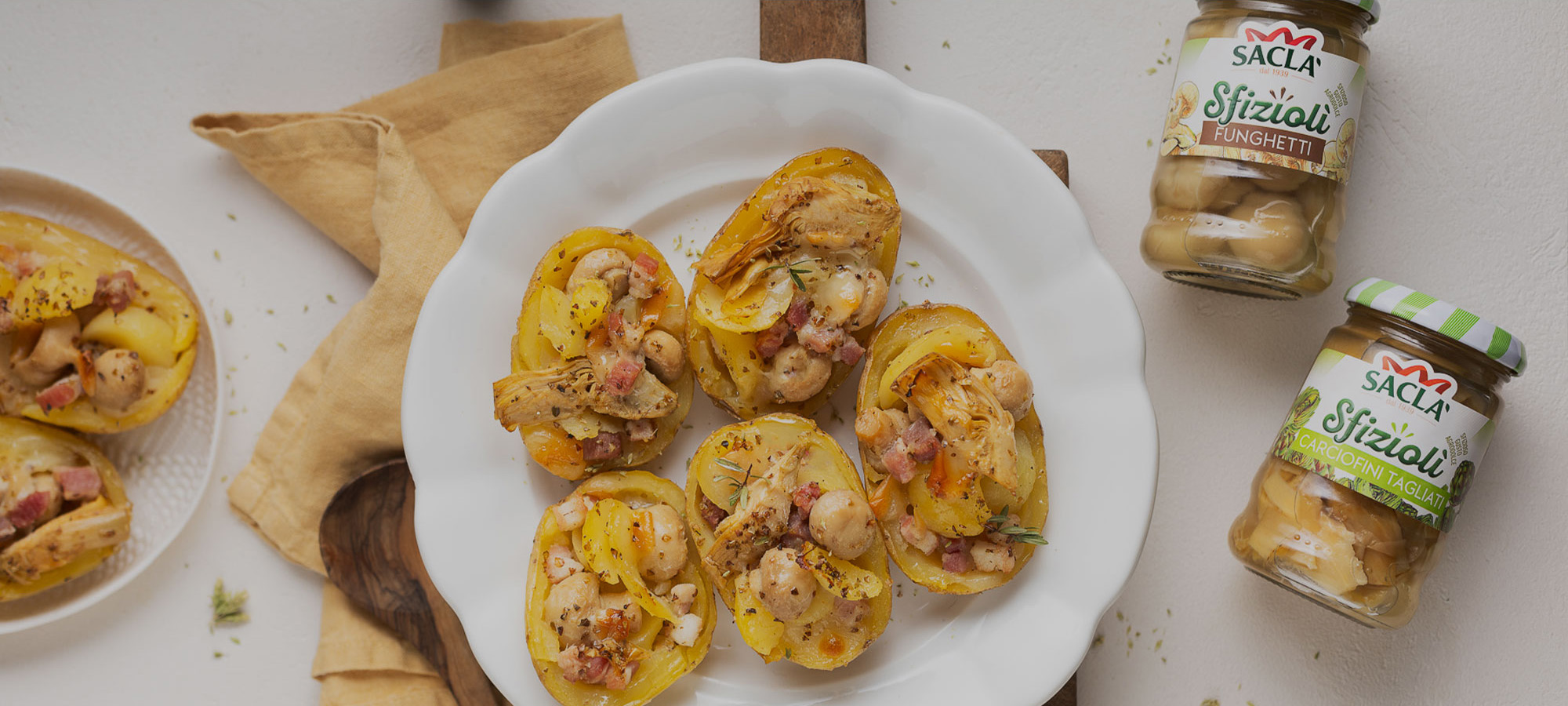 BAKED POTATOES STUFFED WITH SMOKED SCAMORZA, BACON &amp; SACLÀ ARTICHOKES AND MUSHROOMS